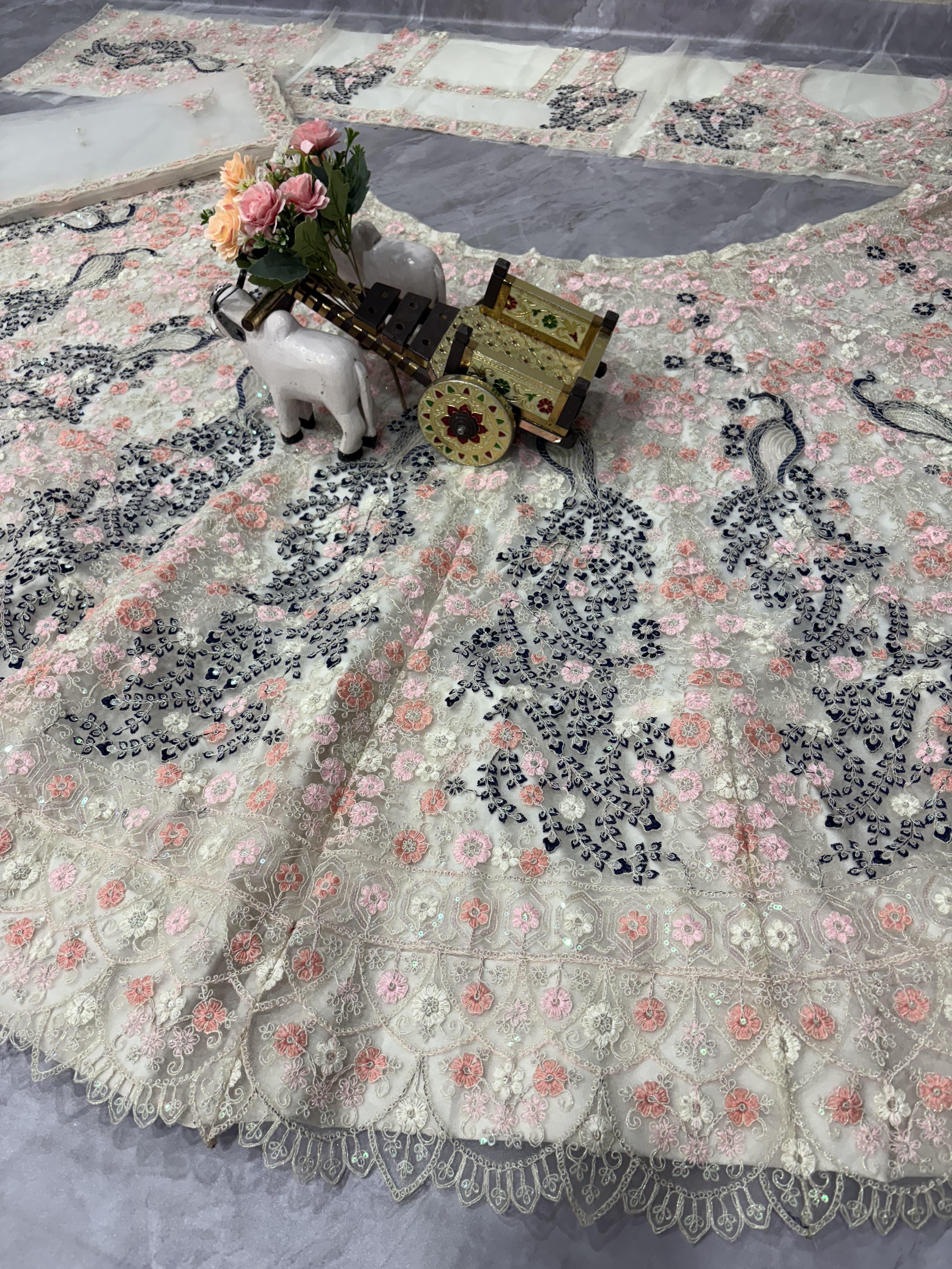 “Designer Pastel Pink Floral Embroidered Lehenga with Peacock Motifs & Net Blouse for Women – Bridal & Party Wear”