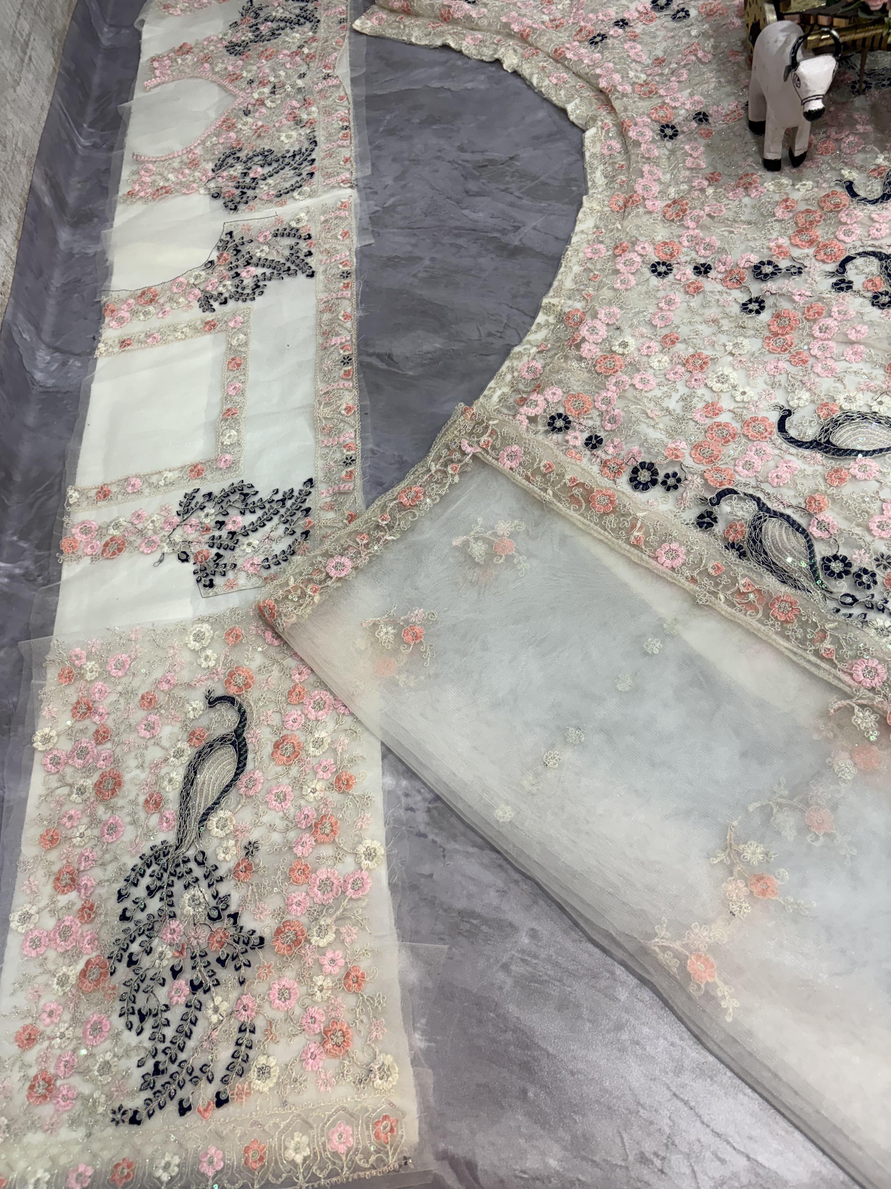 “Designer Pastel Pink Floral Embroidered Lehenga with Peacock Motifs & Net Blouse for Women – Bridal & Party Wear”
