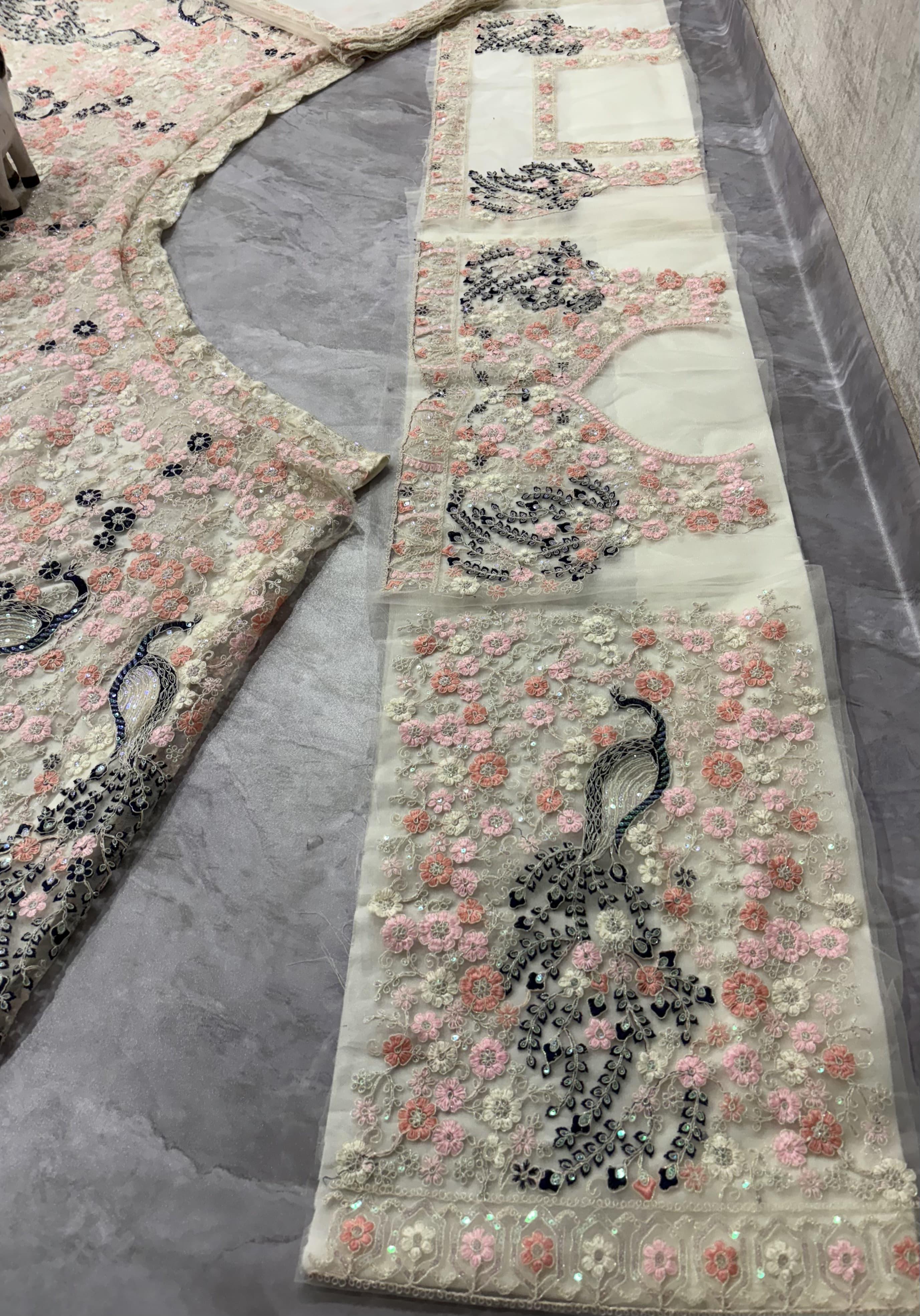 “Designer Pastel Pink Floral Embroidered Lehenga with Peacock Motifs & Net Blouse for Women – Bridal & Party Wear”