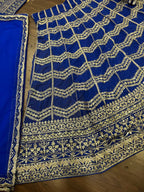 royal blue lehenga with heavy golden zari and sequin embroidery