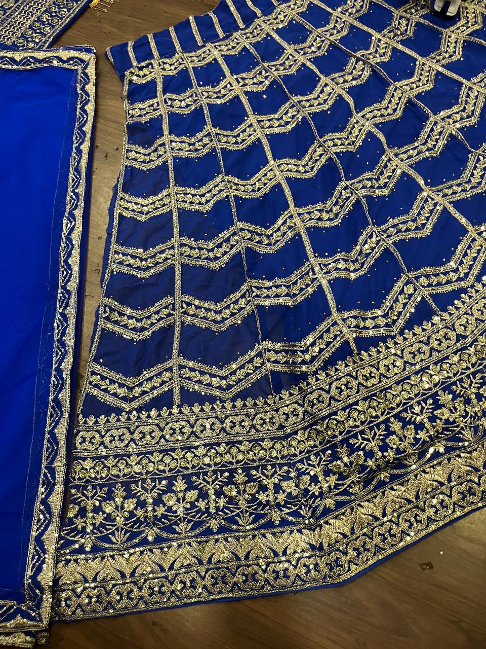 royal blue lehenga with heavy golden zari and sequin embroidery