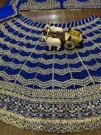 royal blue lehenga with heavy golden zari and sequin embroidery