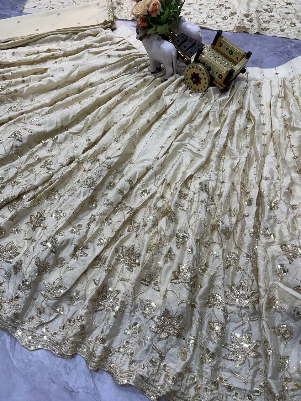Cream Silk Embroidered Lehenga Set with Golden Zari and Sequin Work