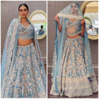 Powder Blue Heavy Embroidered Lehenga Set with Golden Zari and Sequin Work