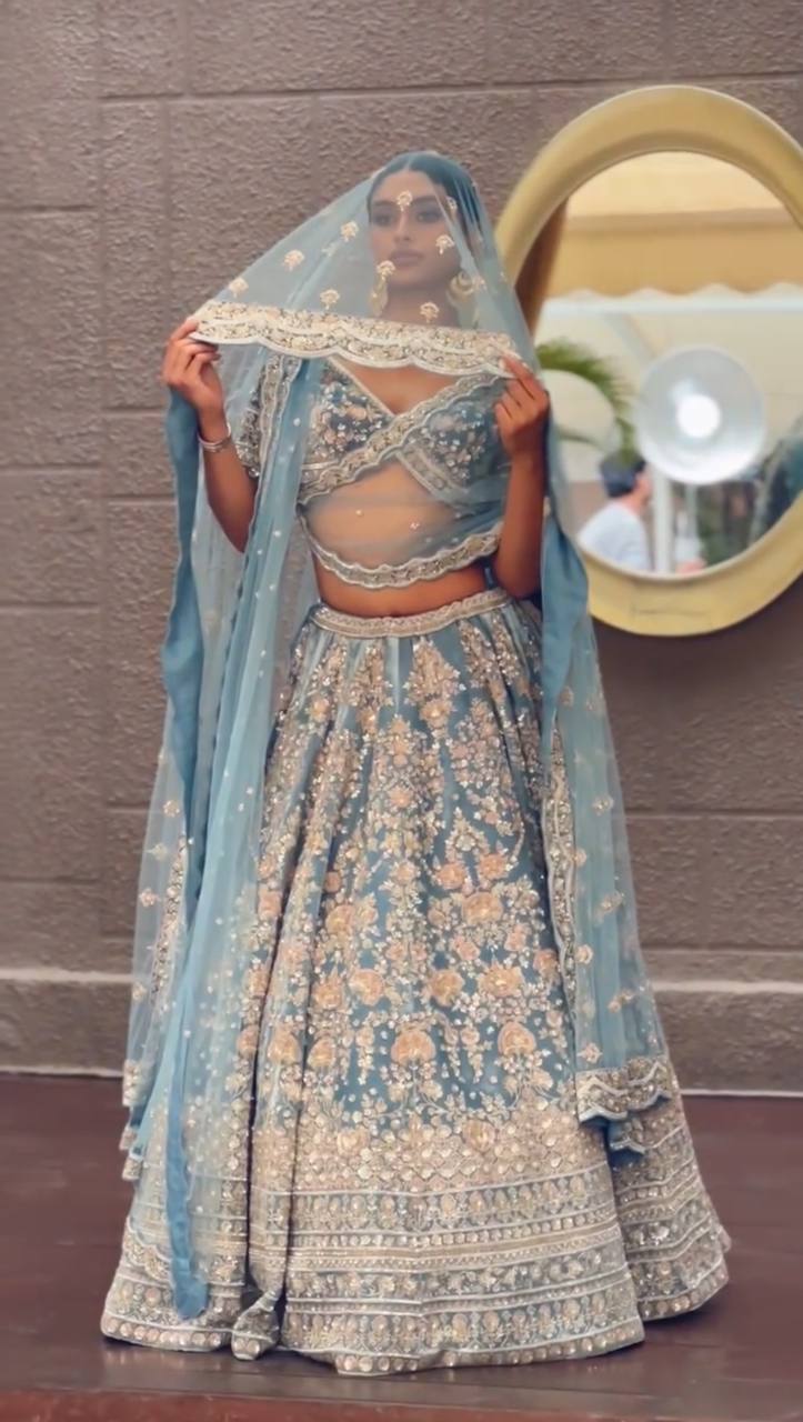 Powder Blue Heavy Embroidered Lehenga Set with Golden Zari and Sequin Work