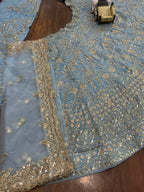 Powder Blue Heavy Embroidered Lehenga Set with Golden Zari and Sequin Work