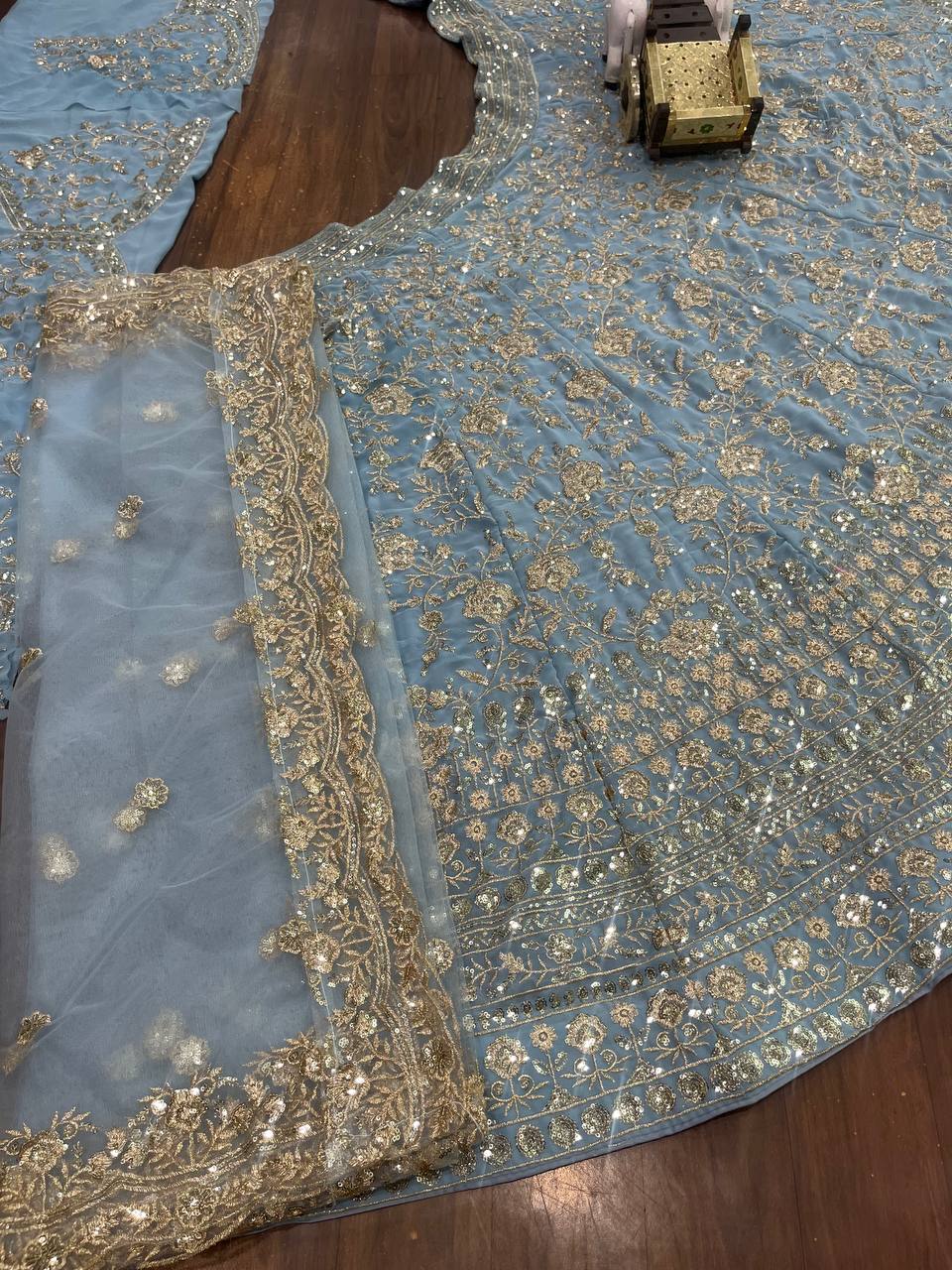 Powder Blue Heavy Embroidered Lehenga Set with Golden Zari and Sequin Work