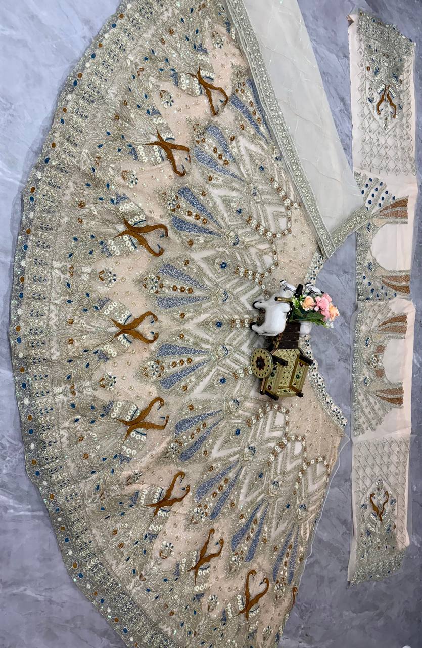 Ivory Gold Peacock Embroidered Net Lehenga Choli with Blue Accents