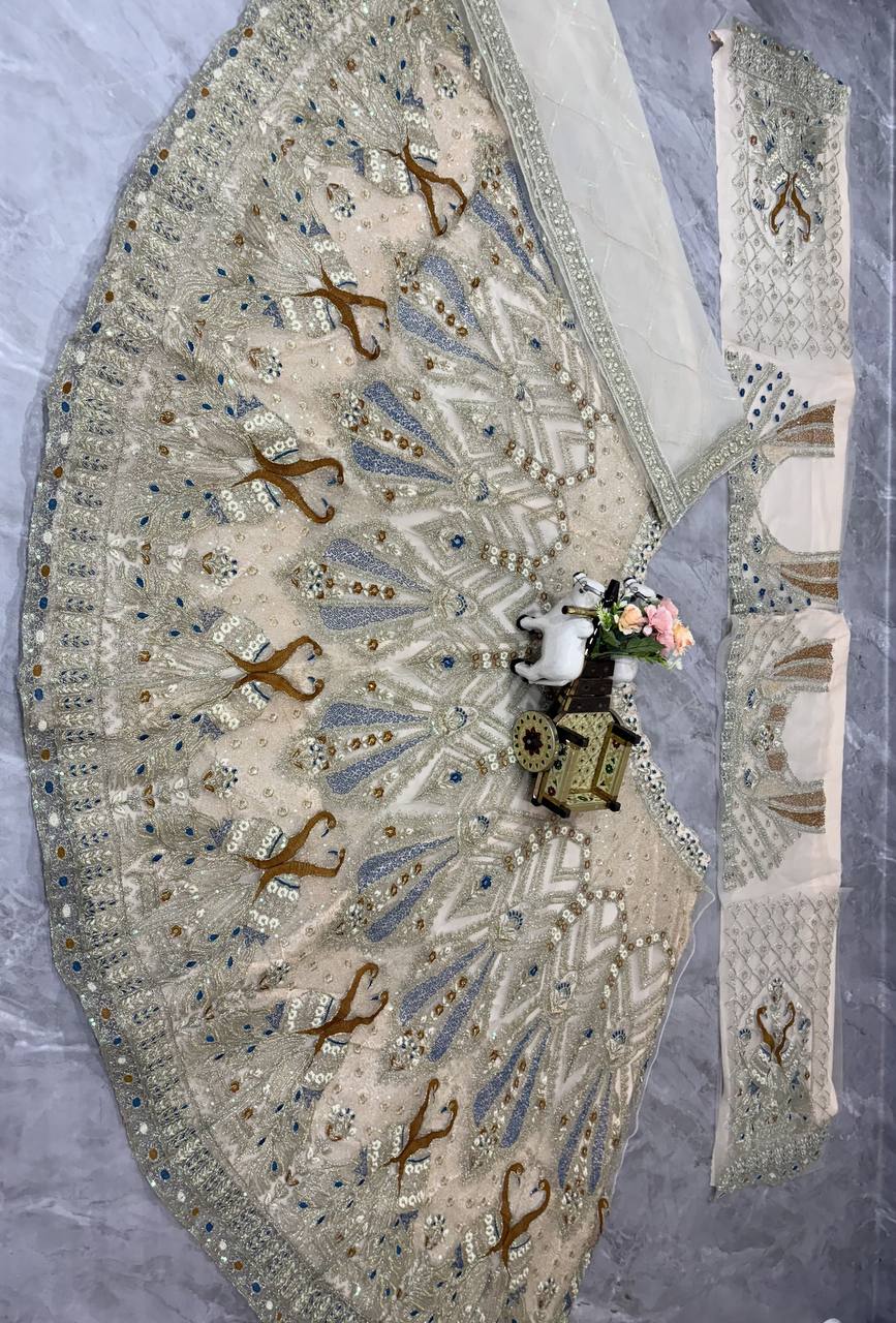 Ivory Gold Peacock Embroidered Net Lehenga Choli with Blue Accents