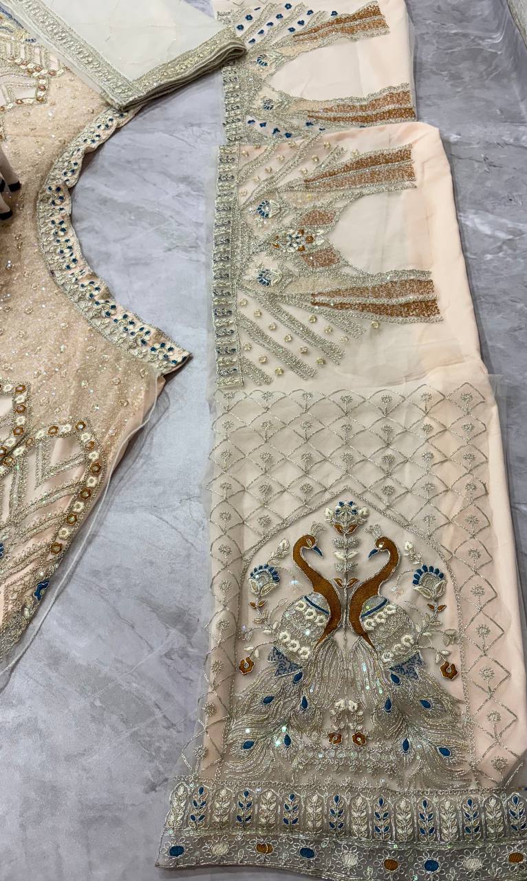 Ivory Gold Peacock Embroidered Net Lehenga Choli with Blue Accents