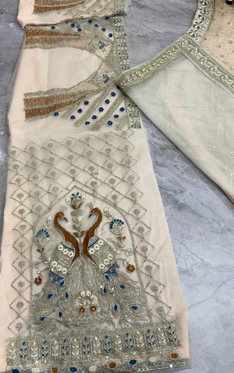 Ivory Gold Peacock Embroidered Net Lehenga Choli with Blue Accents