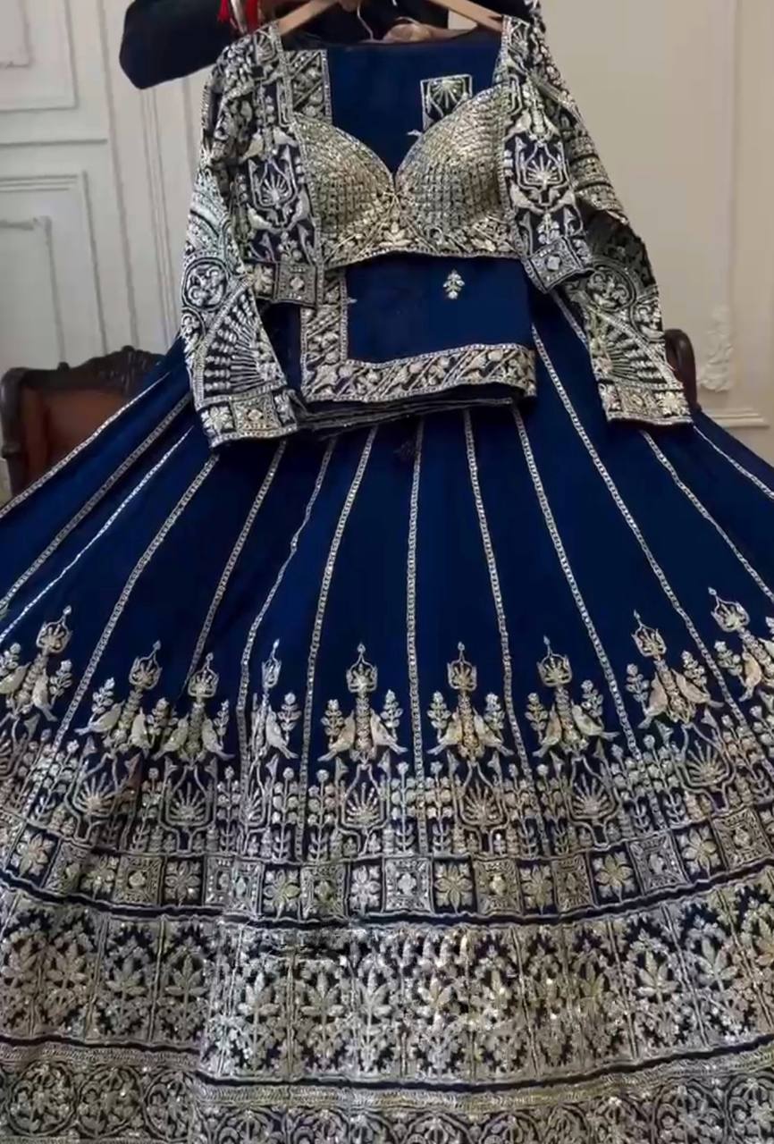 deep navy blue ensemble with intricate silver zari and thread embroidery