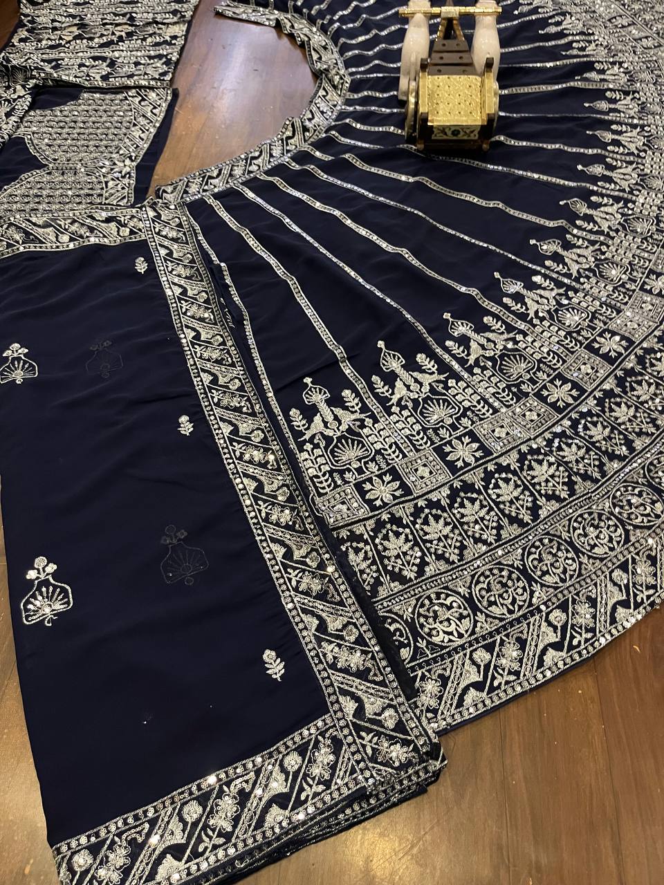 deep navy blue ensemble with intricate silver zari and thread embroidery