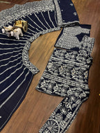 deep navy blue ensemble with intricate silver zari and thread embroidery
