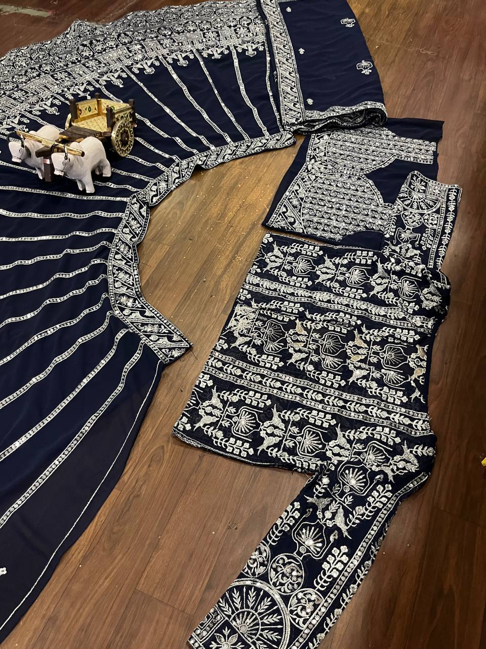deep navy blue ensemble with intricate silver zari and thread embroidery