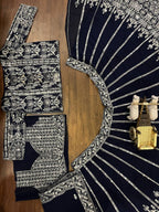deep navy blue ensemble with intricate silver zari and thread embroidery