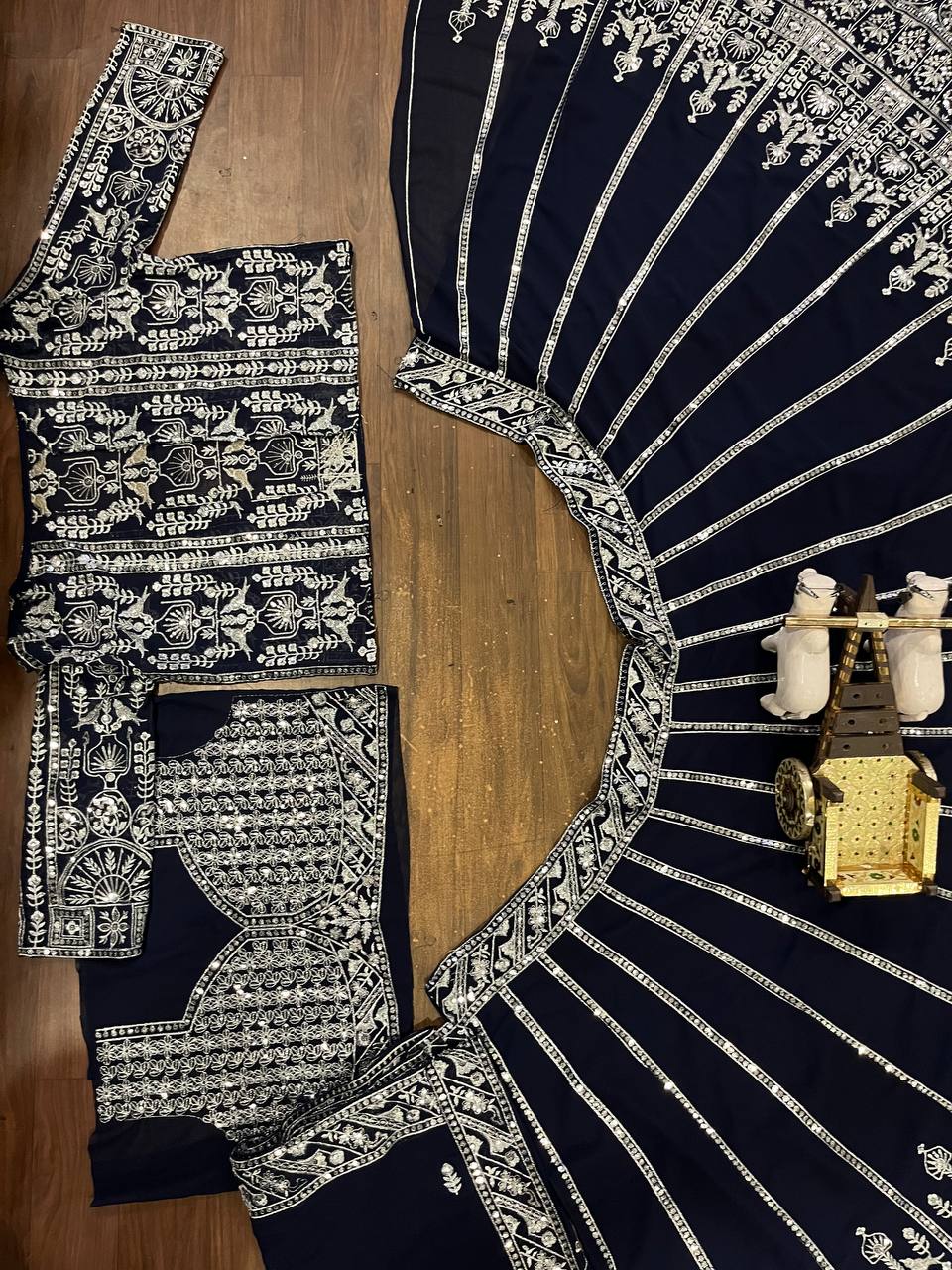 deep navy blue ensemble with intricate silver zari and thread embroidery