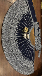 deep navy blue ensemble with intricate silver zari and thread embroidery
