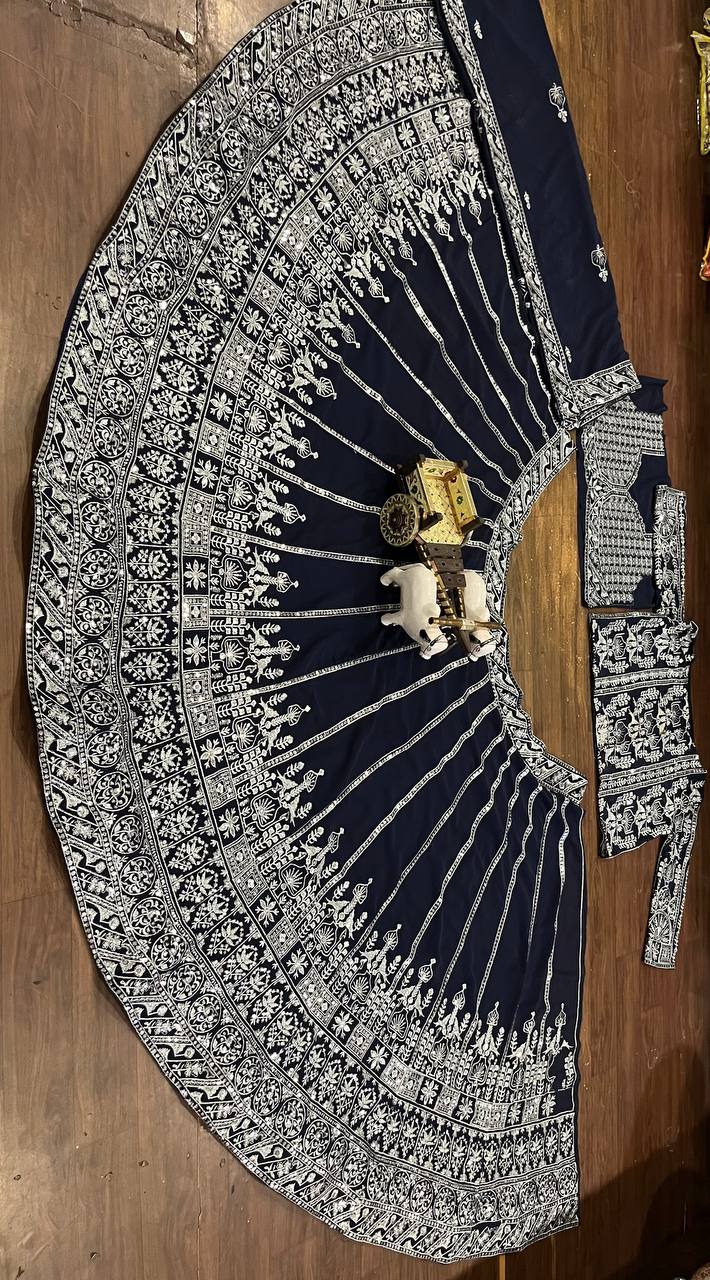 deep navy blue ensemble with intricate silver zari and thread embroidery