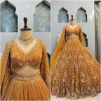 "Majestic Mustard Yellow Lehenga with Heavy Golden Zari & Sequins Embroidery – Bridal & Festive Wear"