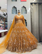 "Majestic Mustard Yellow Lehenga with Heavy Golden Zari & Sequins Embroidery – Bridal & Festive Wear"