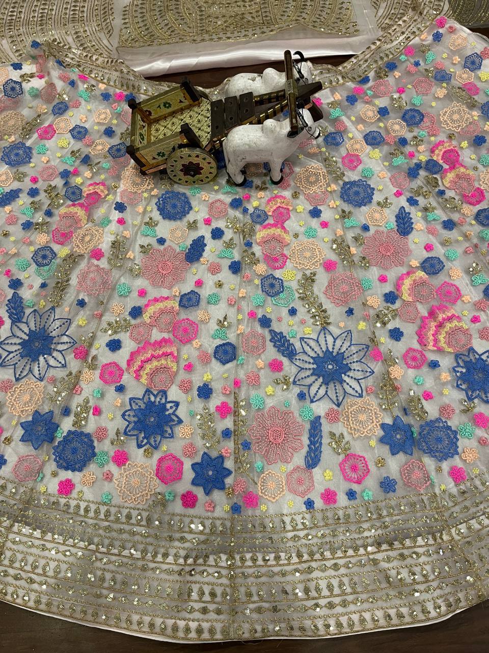 White Soft Net Lehenga Choli with Multicolor Embroidery & Sequin Accents