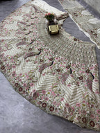 "Ivory White Embroidered Net Lehenga with Peacock & Floral Sequins Work – Bridal & Festive Wear"