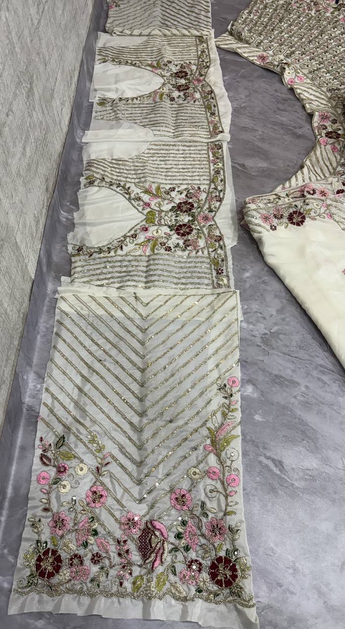 "Ivory White Embroidered Net Lehenga with Peacock & Floral Sequins Work – Bridal & Festive Wear"