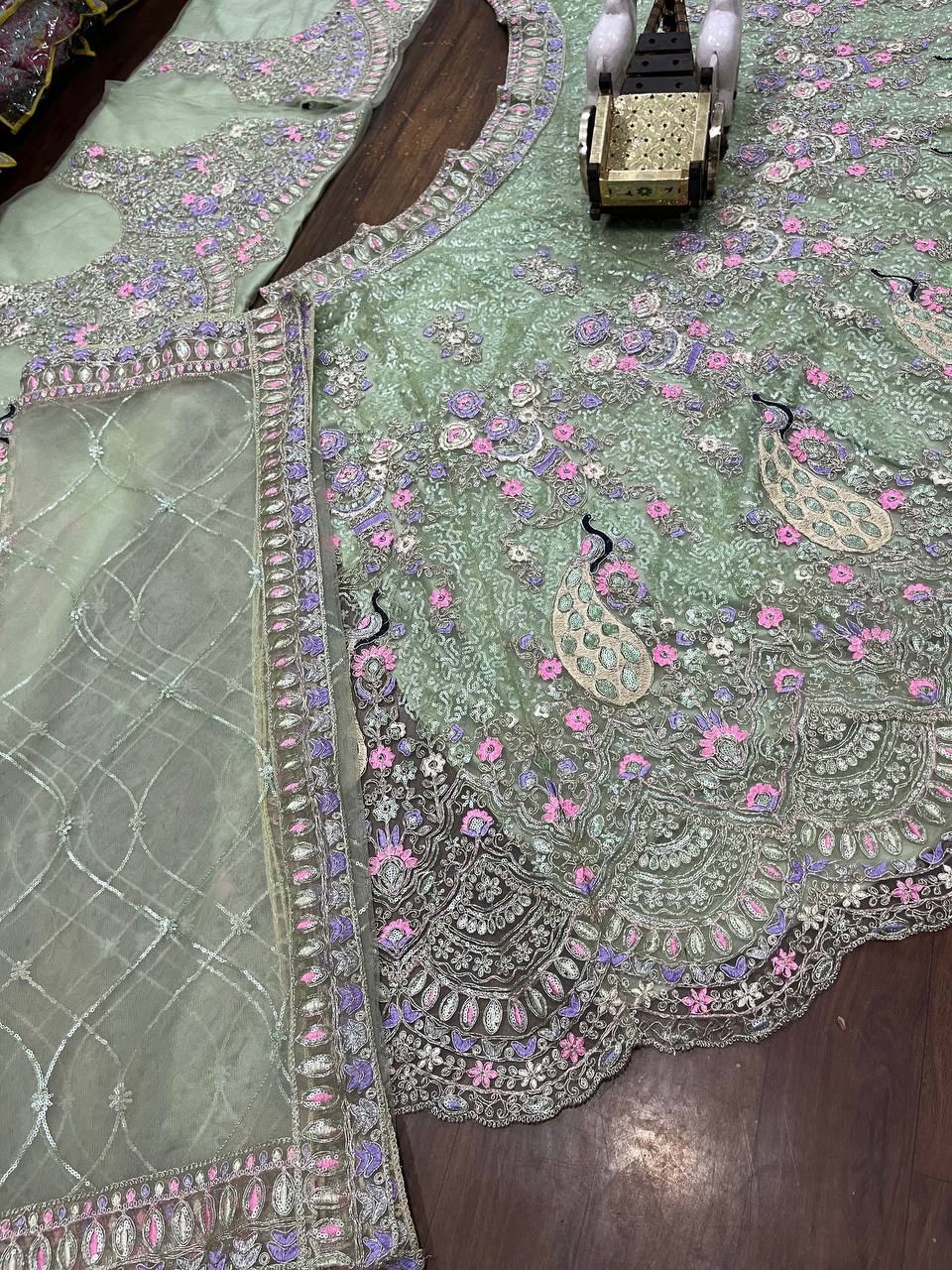 Mint Green Soft Net Lehenga Choli with Peacock and Multi-Thread Embroidery