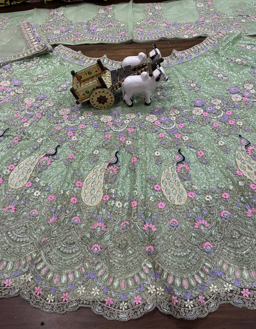 Mint Green Soft Net Lehenga Choli with Peacock and Multi-Thread Embroidery