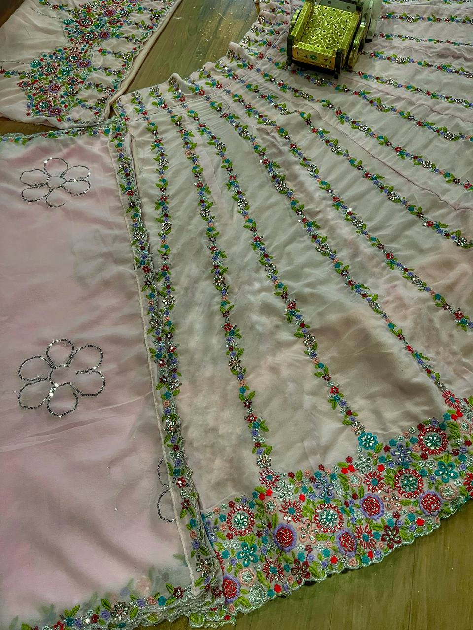 Pastel Pink Multicolor Thread Embroidered Net Lehenga Set