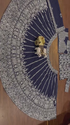 Deep navy blue ensemble with intricate silver zari and thread embroidery