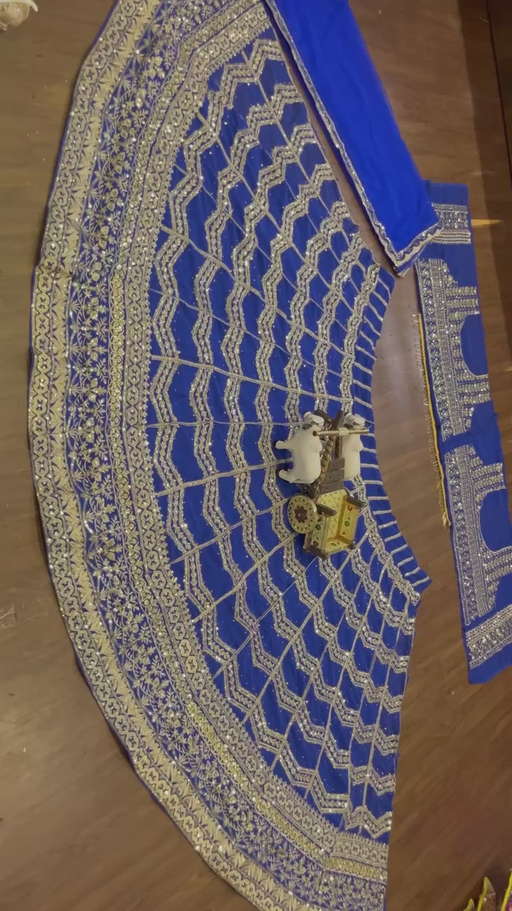Royal blue lehenga with heavy golden zari and sequin embroidery